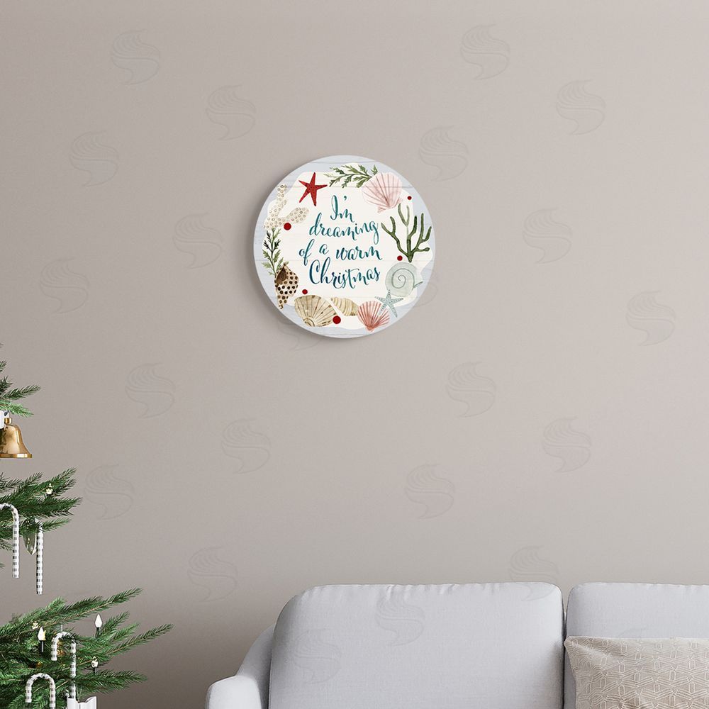 Victoria Barnes Dreaming of Warm Christmas Nautical Beach Holiday Phrase Round Wall Plaque Art Print in Room