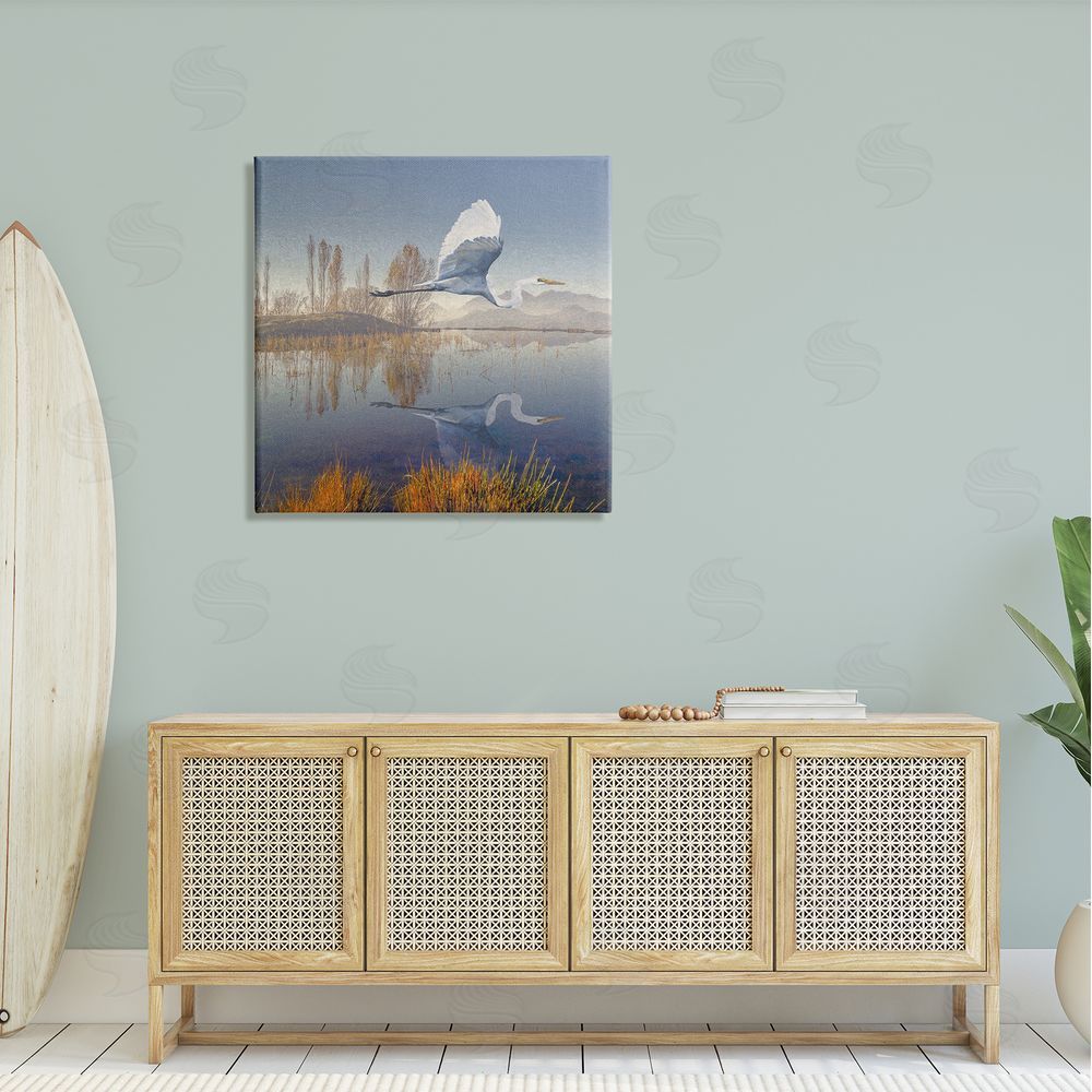 Steve Hunziker Heron Flying Lake Reflection Canvas Wall Art in Room