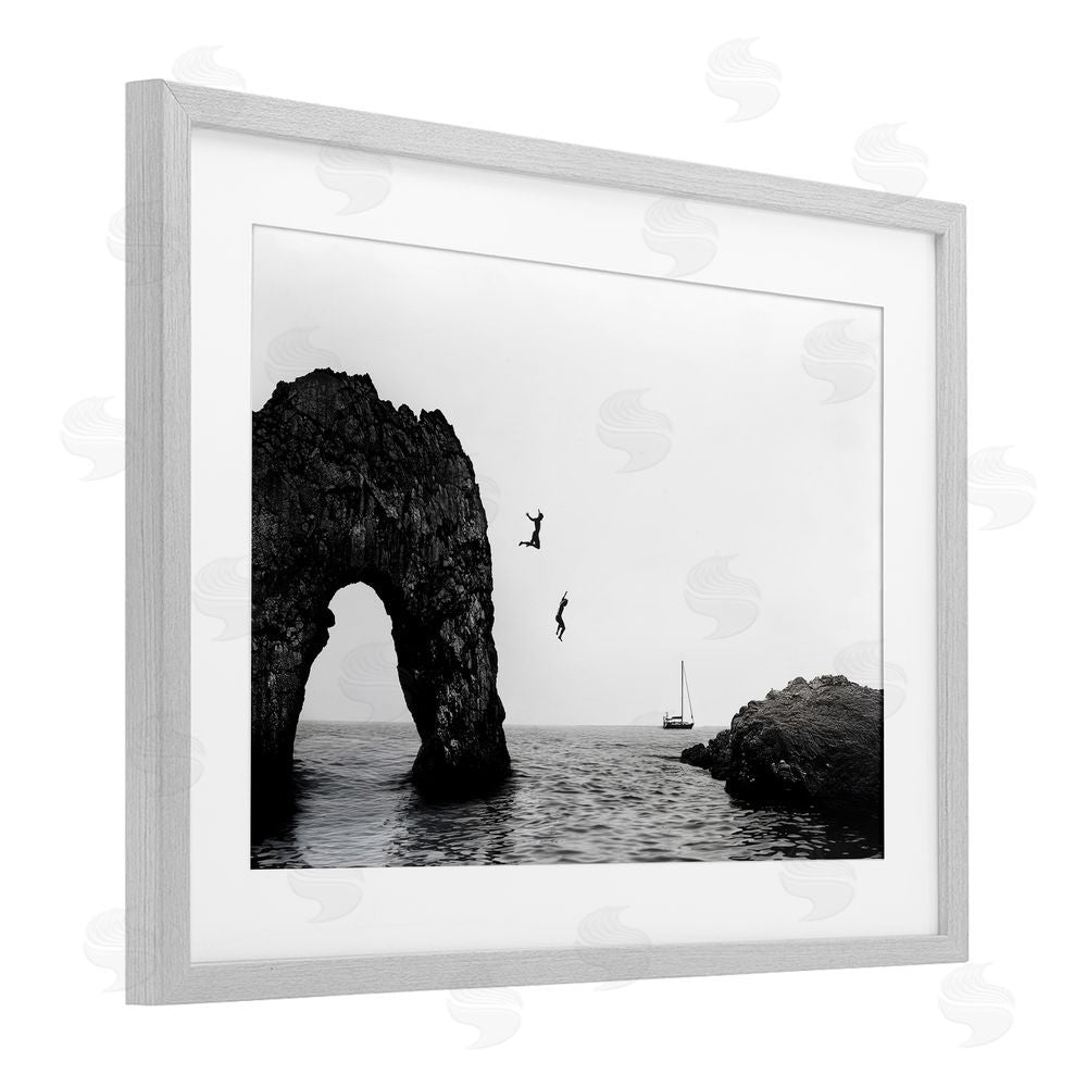Sisi and Seb Cliff Jumping into Sea Gray Framed Print Under Glass Art