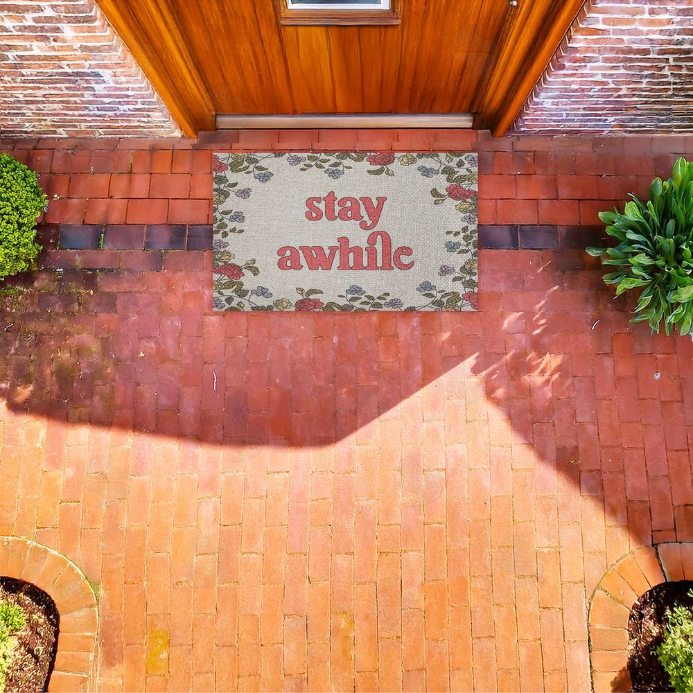 Stupell Studio Stay Awhile Inviting Florals Outdoor Faux Sisal Door Mat