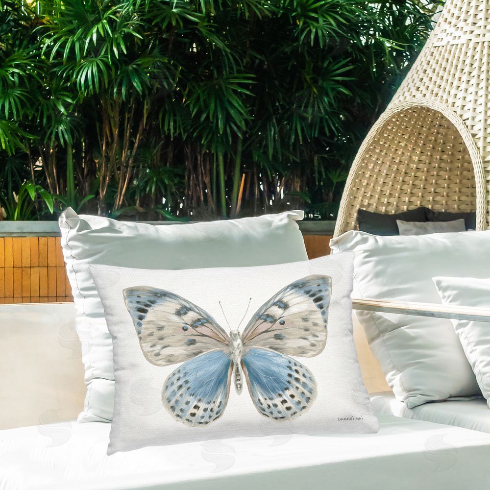 Danhui Nai Blue & White Butterfly Outdoor Rectangular Pillow on Patio