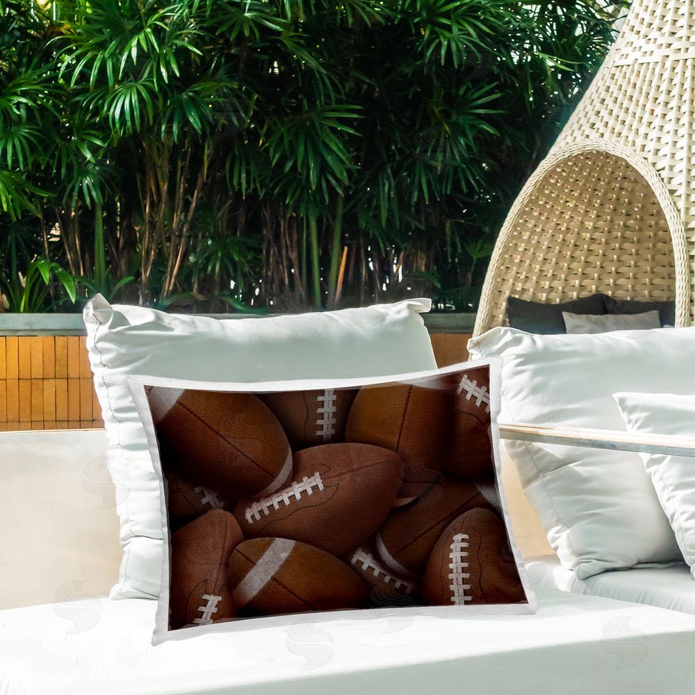 Marcus Prime Bin Of Footballs Outdoor Rectangular Pillow on Patio