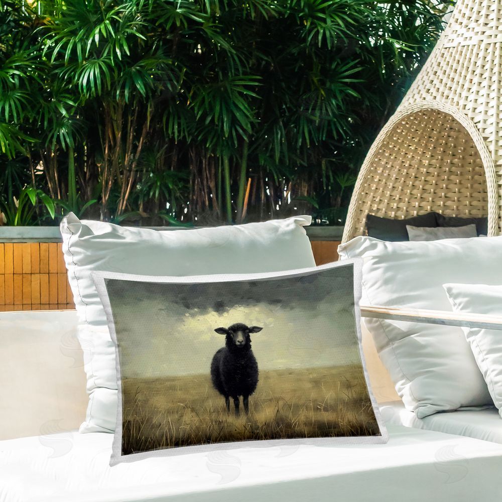 Arlington Prints Black Sheep in Field Outdoor Rectangular Pillow on Patio