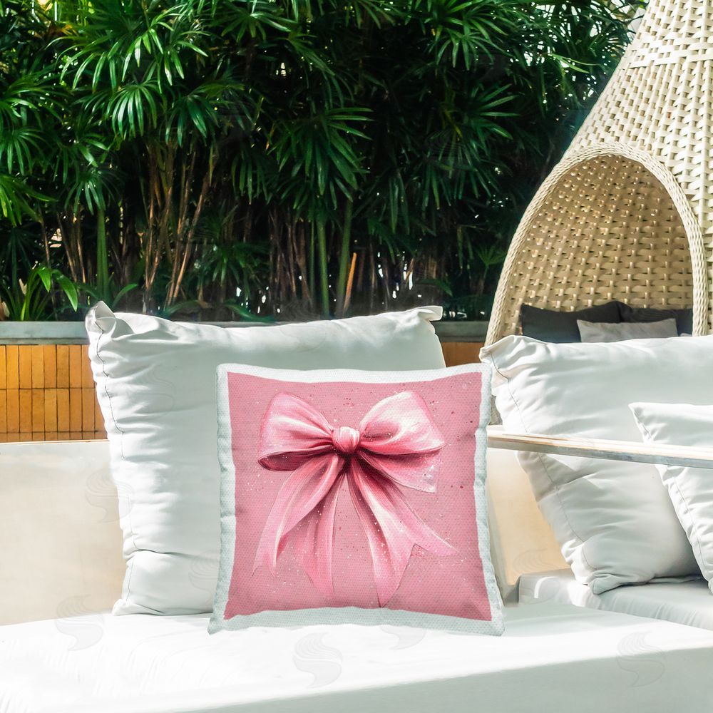 Creative Studio Big Pink Bow with Speckles Outdoor Square Pillow on Patio